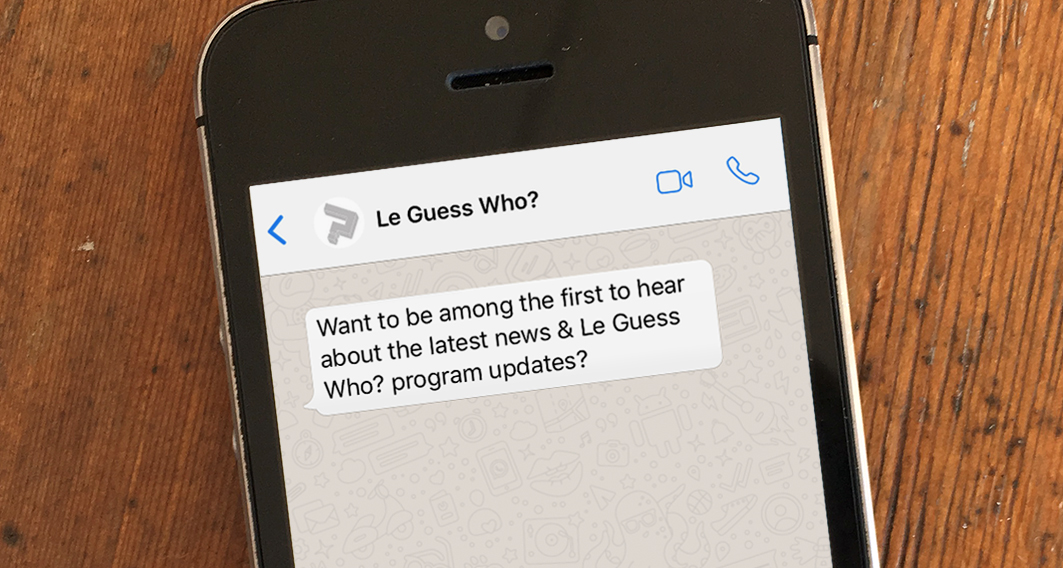 a photo of an iPhone shows the message “Want to be among the first to hear about the latest news & Le Guess Who program updates?”